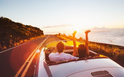 Two people travelling together at sunset