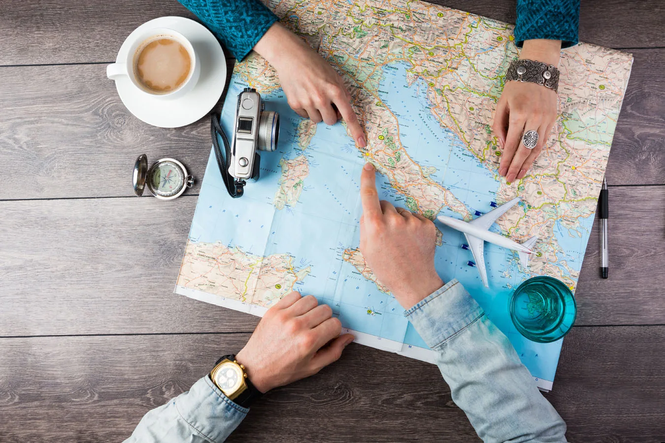 A paper map and plans laid out on a table