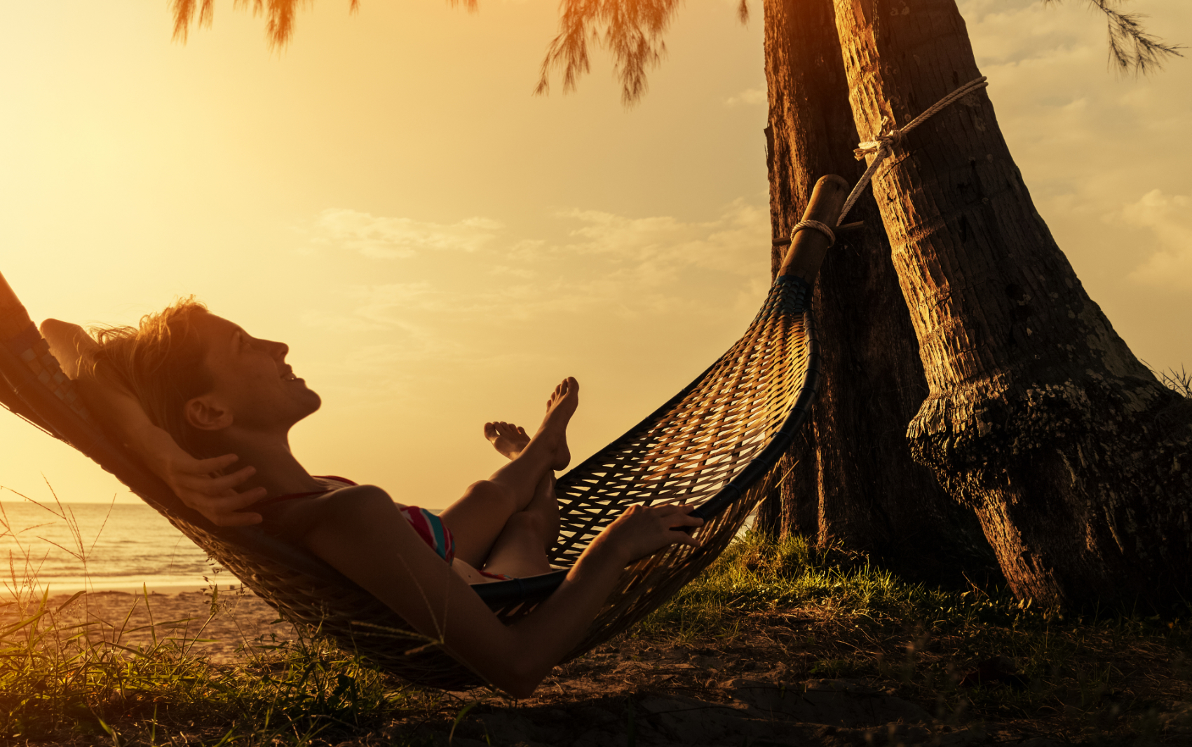 A person resting in a hammock