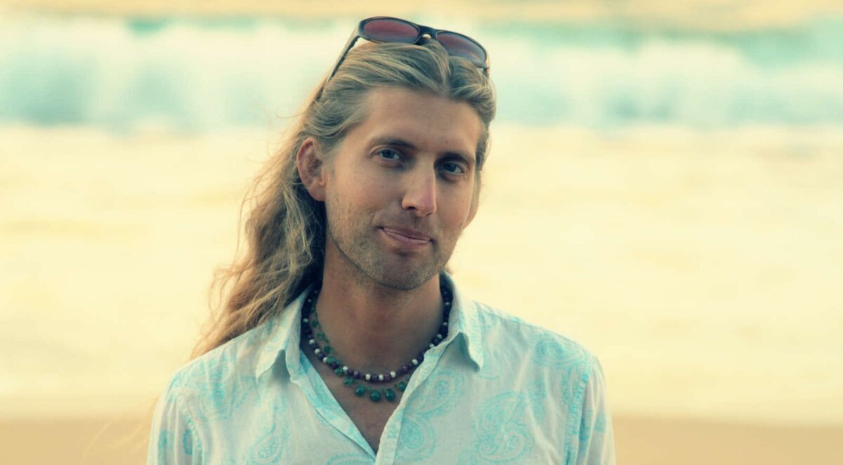 Michael Mackintosh on a beach