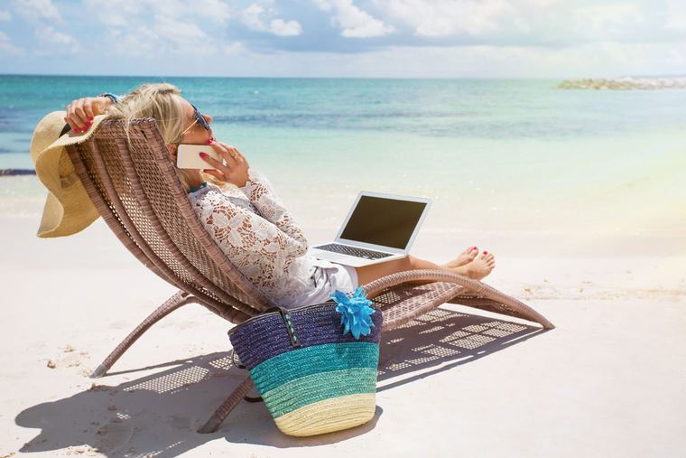 A laptop on a beach lounger
