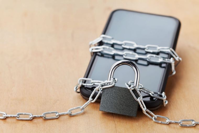 A phone secured with a padlock