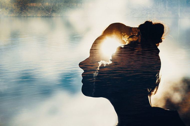 A person outdoors at sunrise